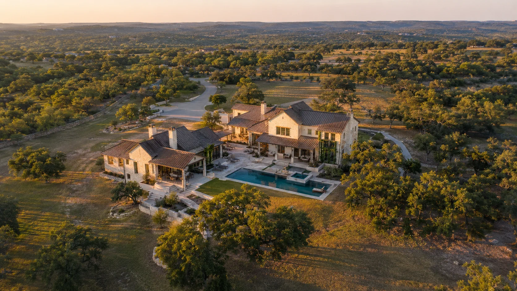 Aerial view illustrating a residence, outdoor improvements, access and surrounding property context